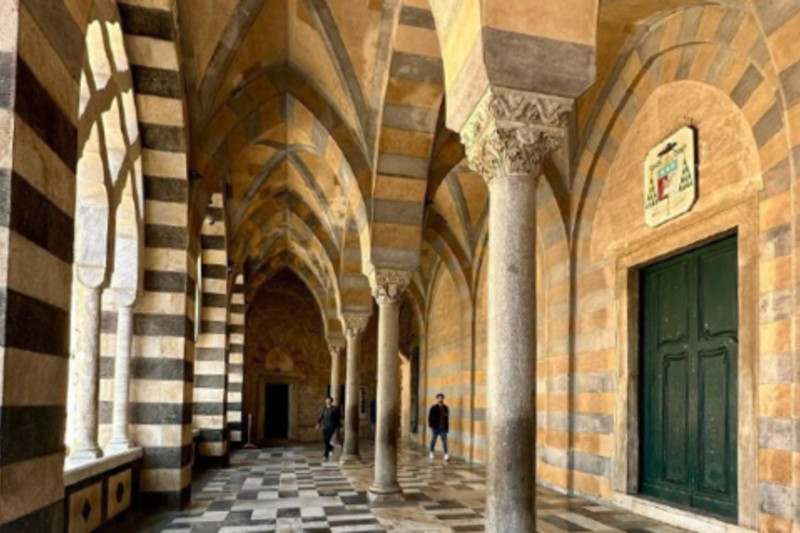 The arcades of an Amalfi cloister in an ExcursionPass archive photograph.