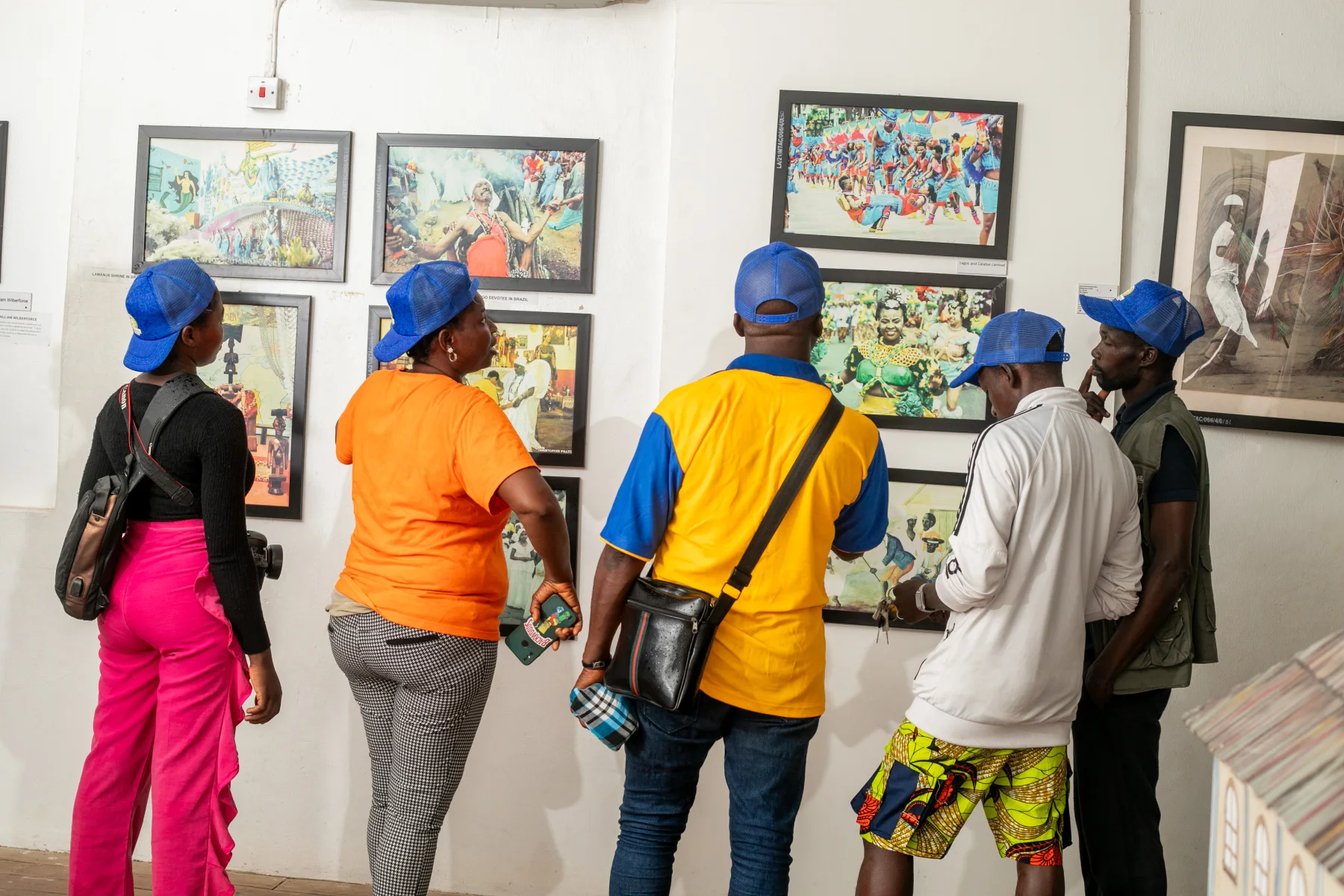 Visitors examine wall displays inside Badagry Heritage Museum