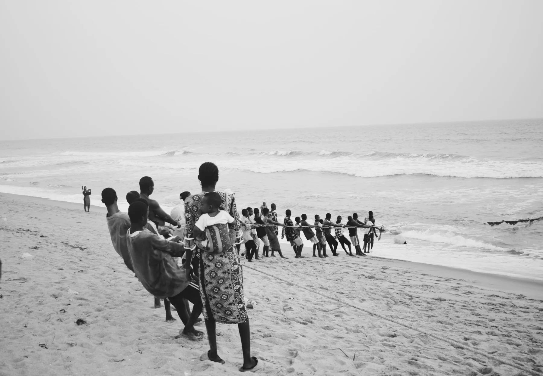 Badagry residents pull in a fishing net at the end of the day.