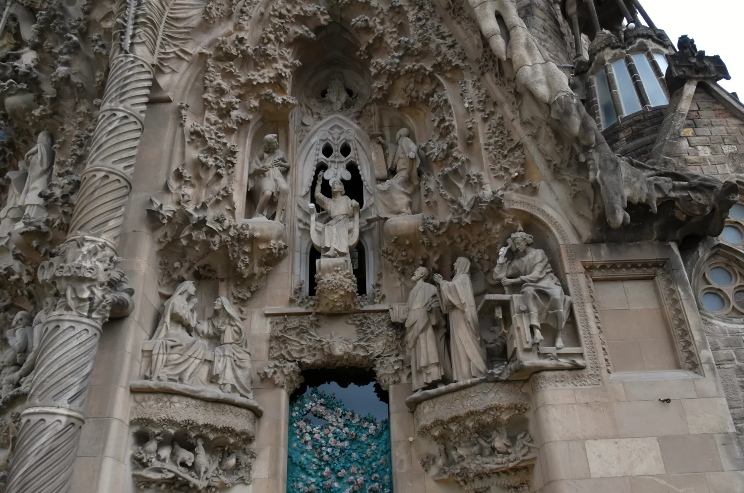 The Charity Portal of the Nativity Façade is crowded with human figures, plants, animals and deeply worked stone