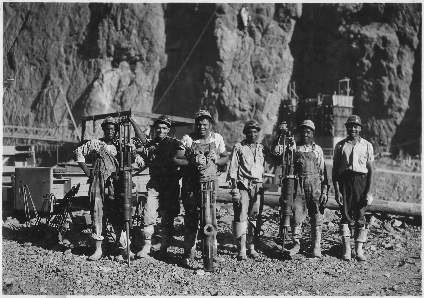 Black drillers work during Hoover Dam construction in a federal archival photograph.