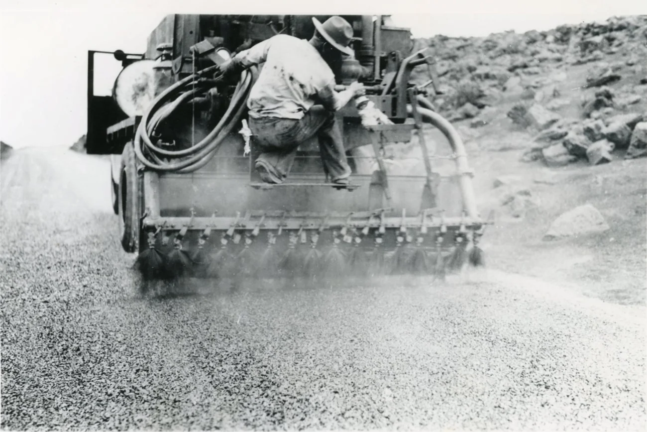 A road-surfacing vehicle works on the Haleakalā Highway during 1935 construction.