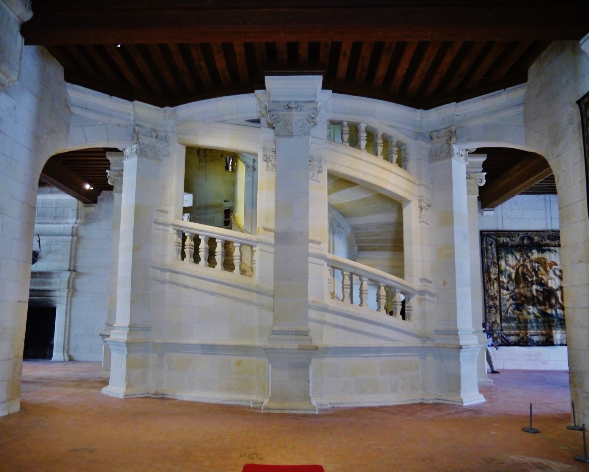 Chambord’s double stair curls around a central open core.