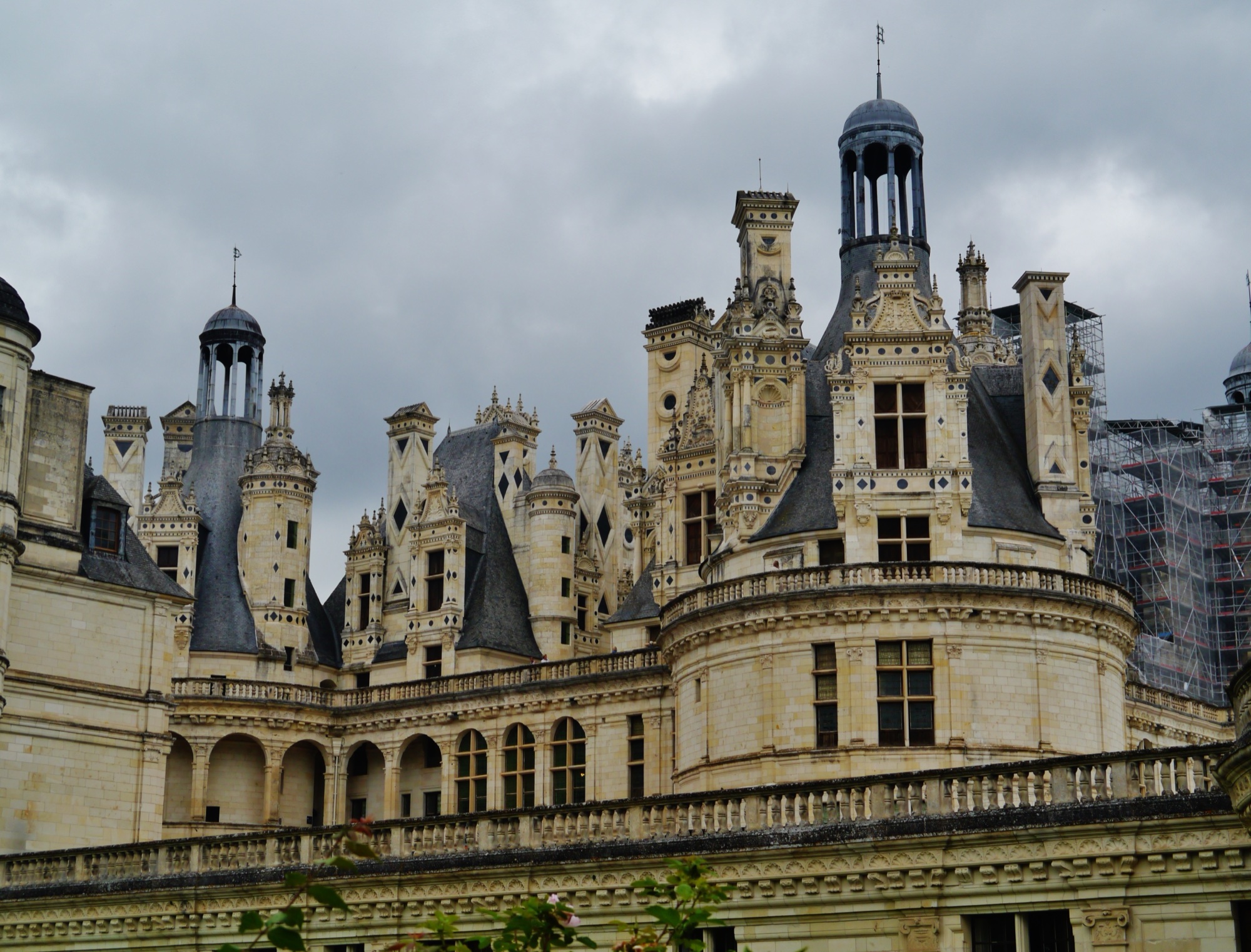 A close roofscape at Chambord shows chimneys, lanterns and carved stone rising above the terraces.