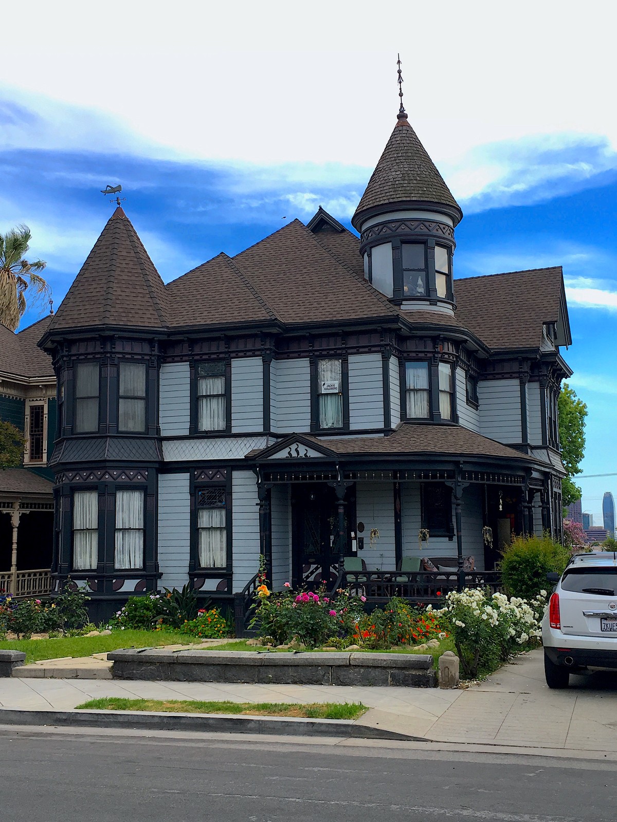 Turrets, projecting bays, patterned trim and a porch distinguish a Victorian-era house in Angelino Heights.