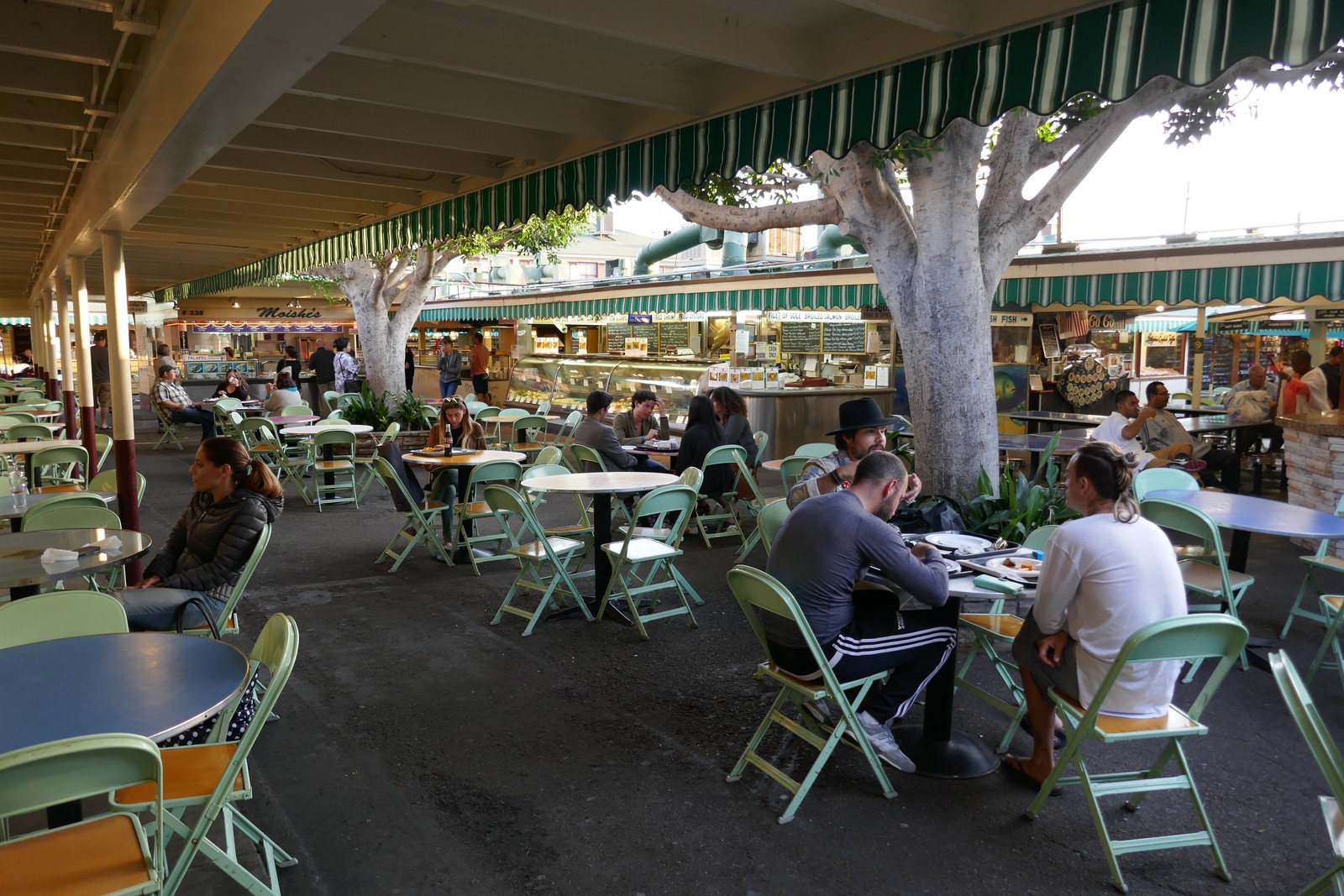 A covered aisle and food counters inside the Original Farmers Market, photographed in 2016.