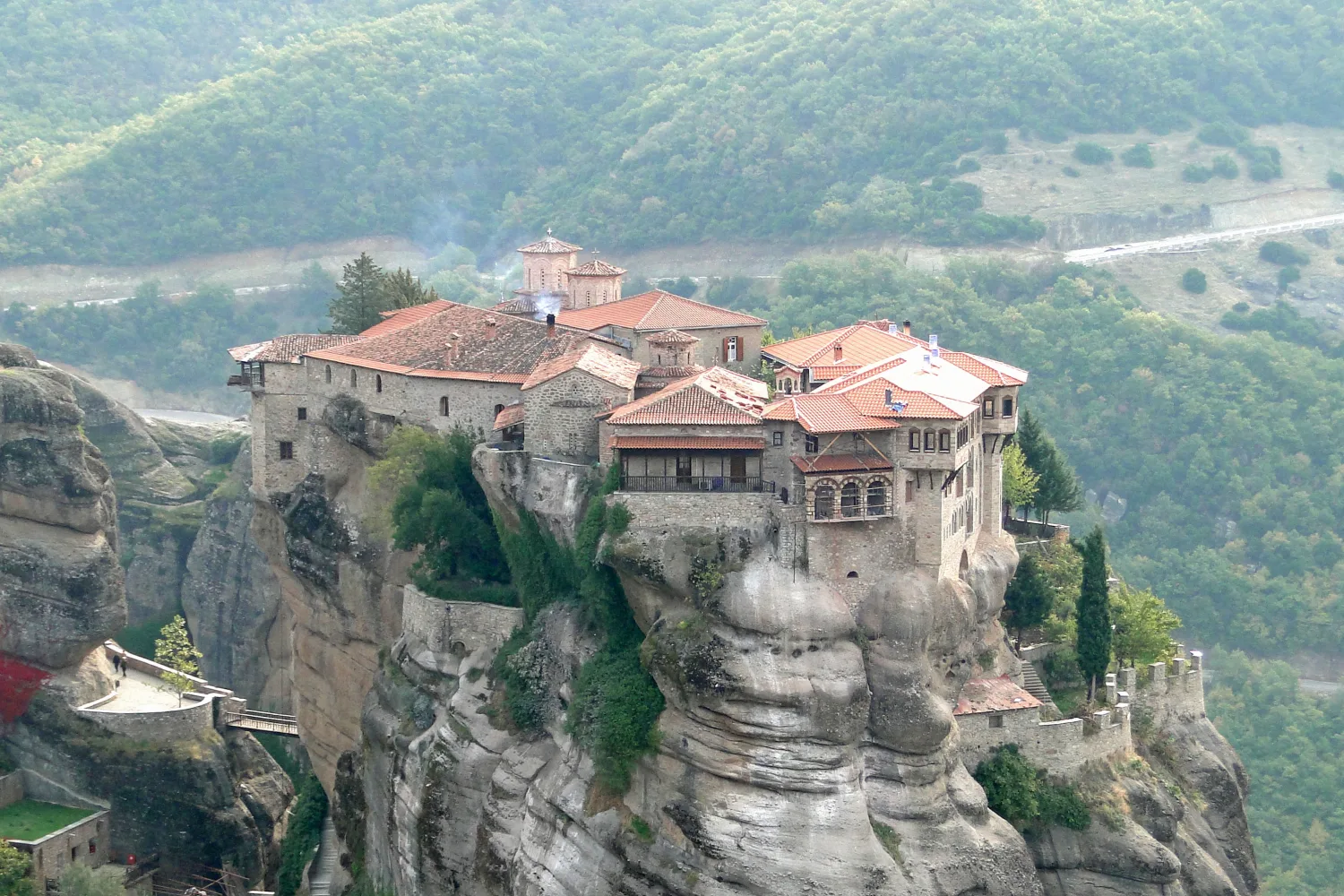 Varlaam Monastery occupying a rounded rock with bridges and stair approaches visible below.