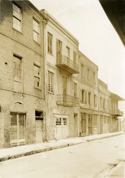 A 1930s Works Progress Administration photograph records Gallatin Street buildings shortly before demolition