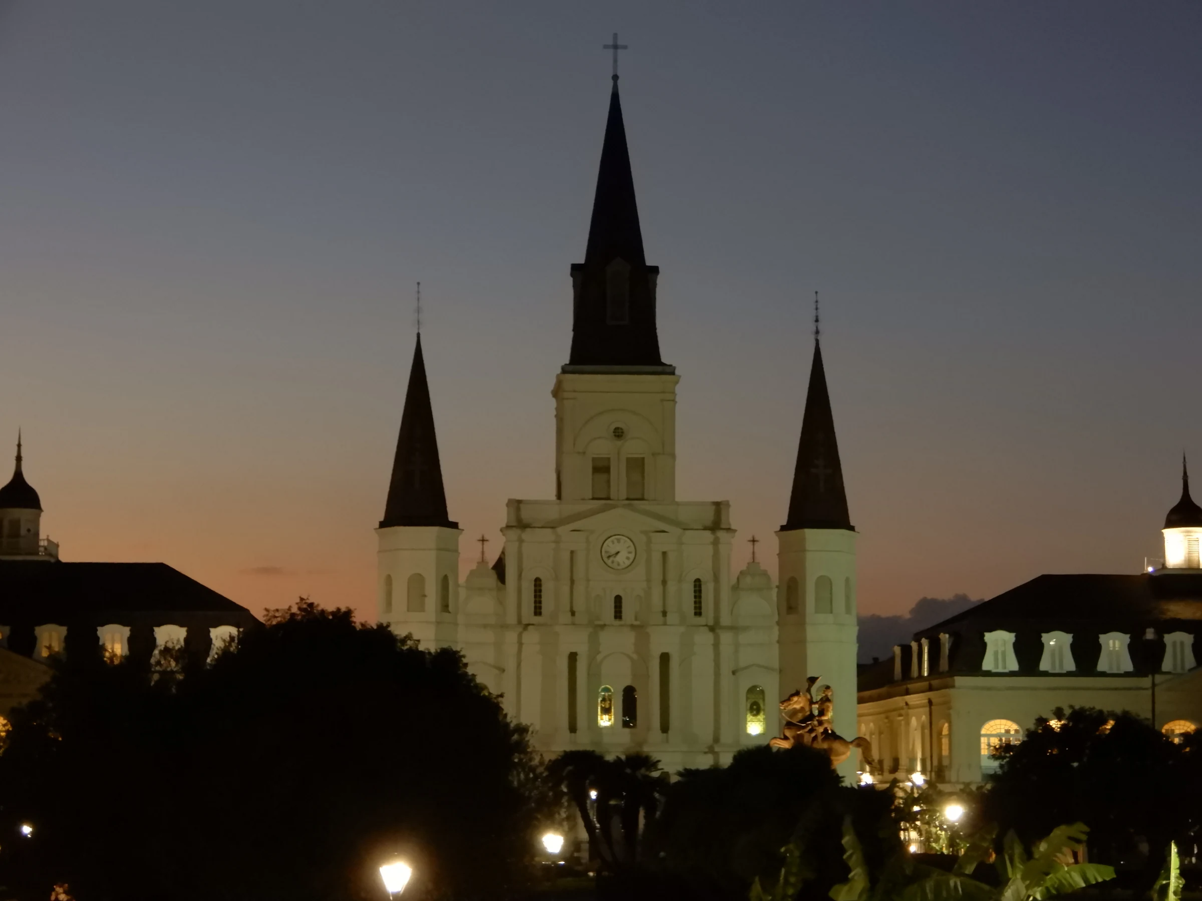 St. Louis Cathedral and the civic buildings face Jackson Square at dusk