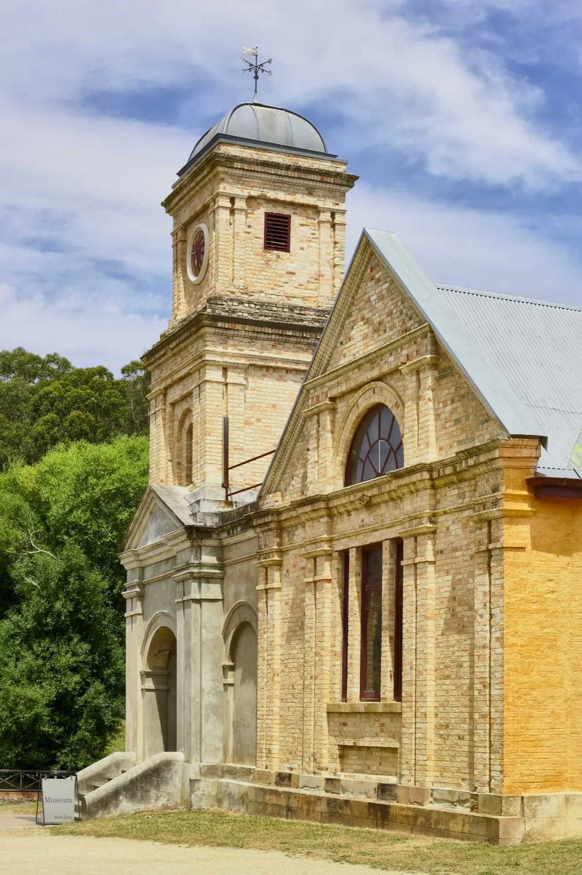 The former Asylum survives as a substantial institutional building beyond the penitentiary ruins.