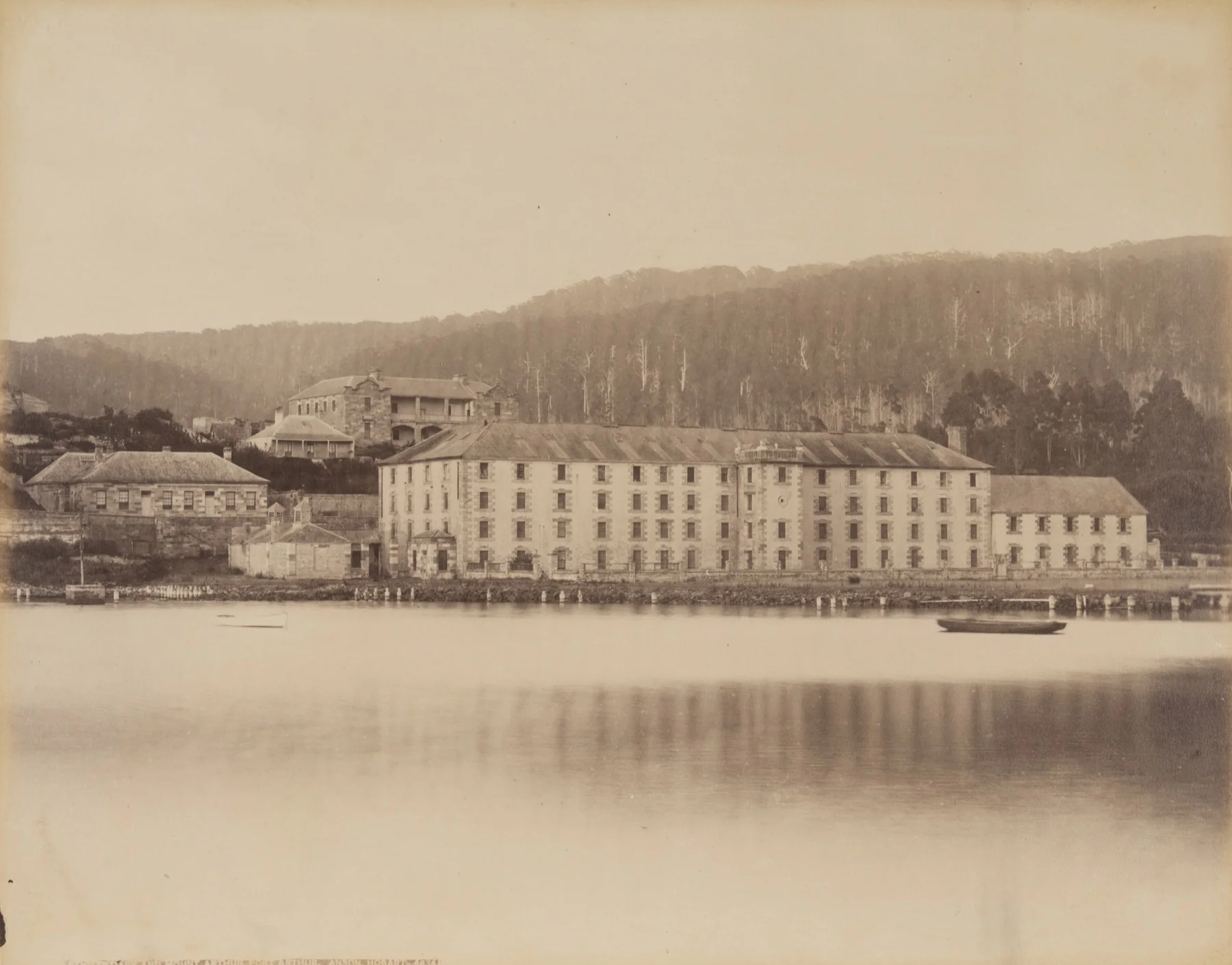 An Anson Brothers photograph records the penitentiary and Mount Arthur after the former mill and granary had been converted.