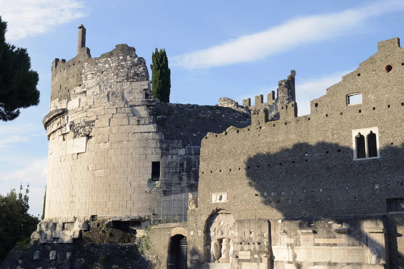 The cylindrical tomb of Cecilia Metella is joined to the walls and buildings of the medieval Castrum Caetani.