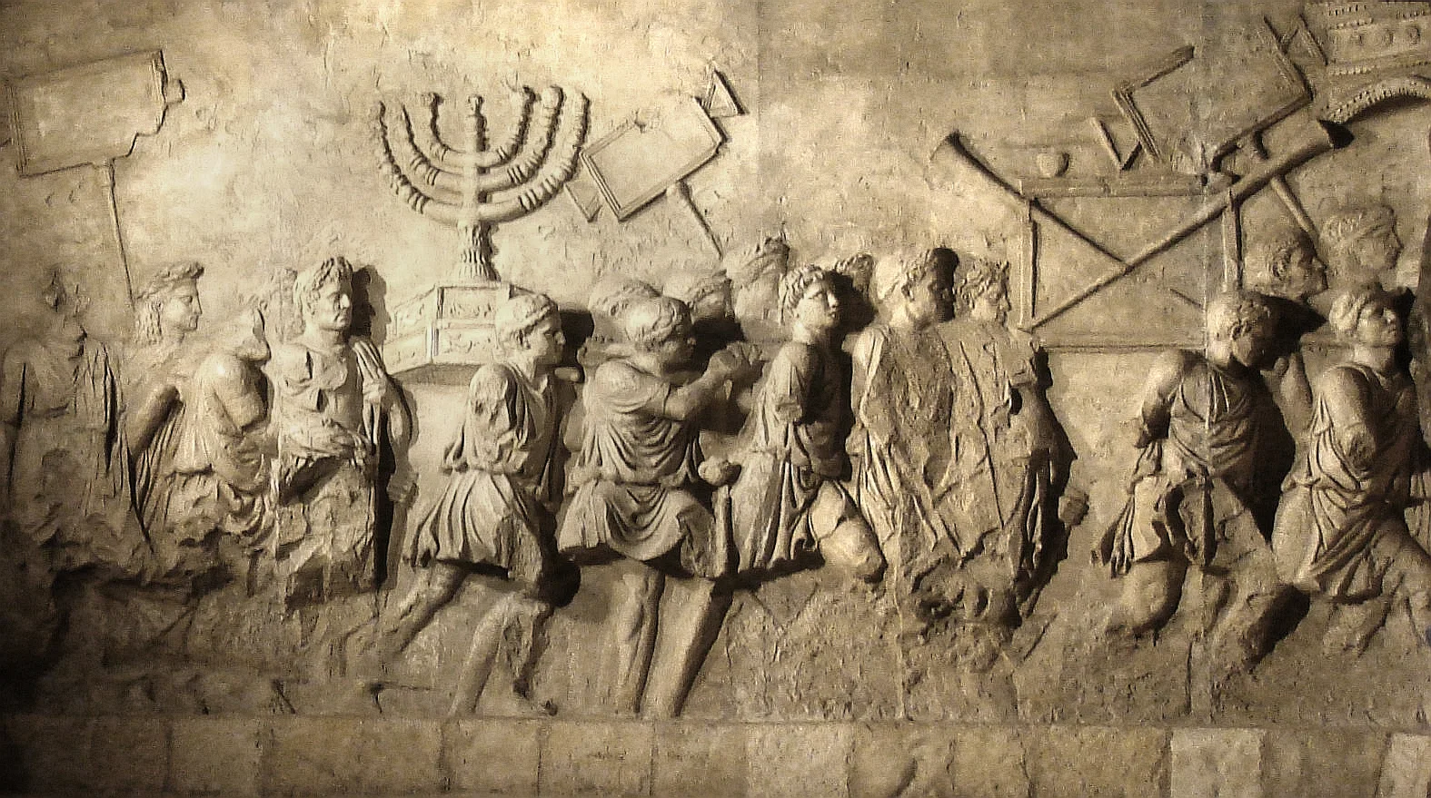 The menorah and other Temple spoils appear in a relief inside the Arch of Titus.