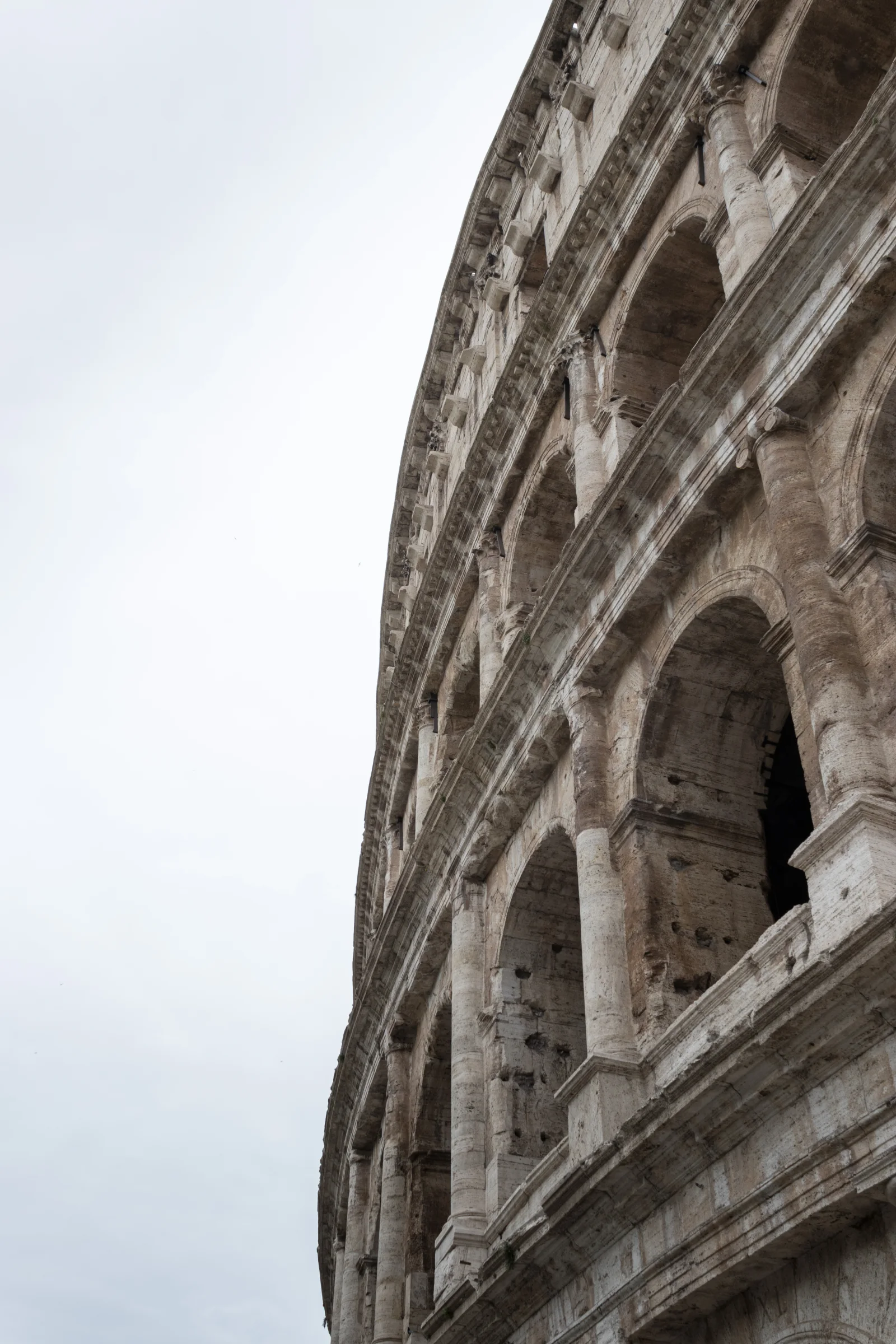 Exterior arcades show the Colosseum as a repaired, inhabited and repeatedly quarried structure.