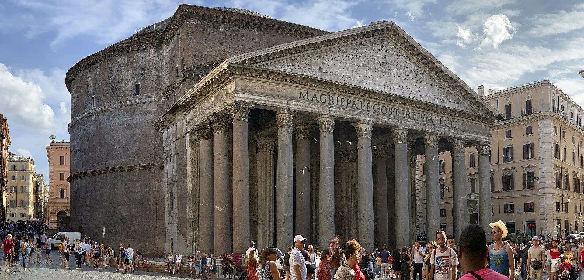 The Pantheon portico and rotunda rise above visitors in Piazza della Rotonda.