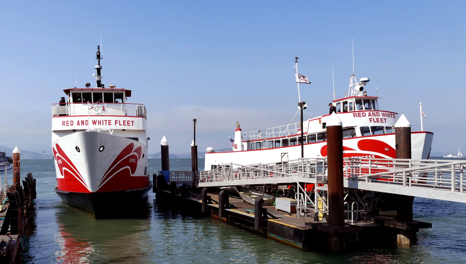 Red and White Fleet sightseeing vessels moored at the San Francisco waterfront.