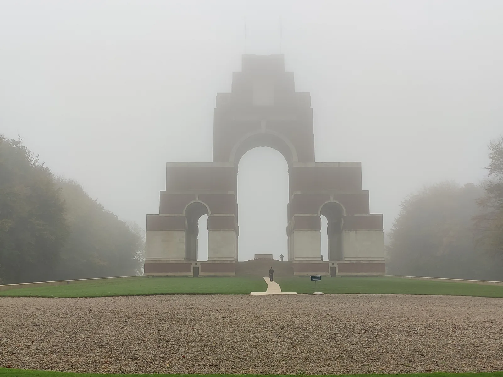 The Thiepval Memorial rises through a sequence of interlocking arches above the surrounding landscape.