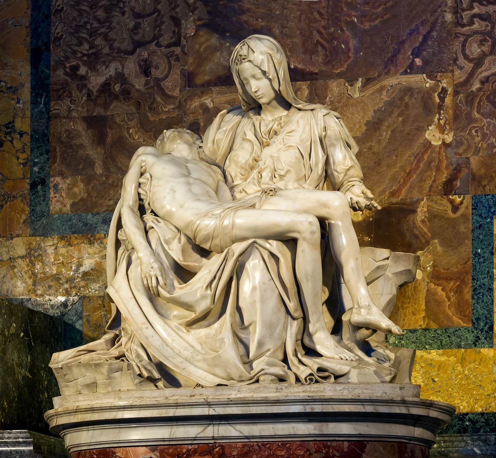 Michelangelo’s Pietà behind its protective setting in St Peter’s Basilica.