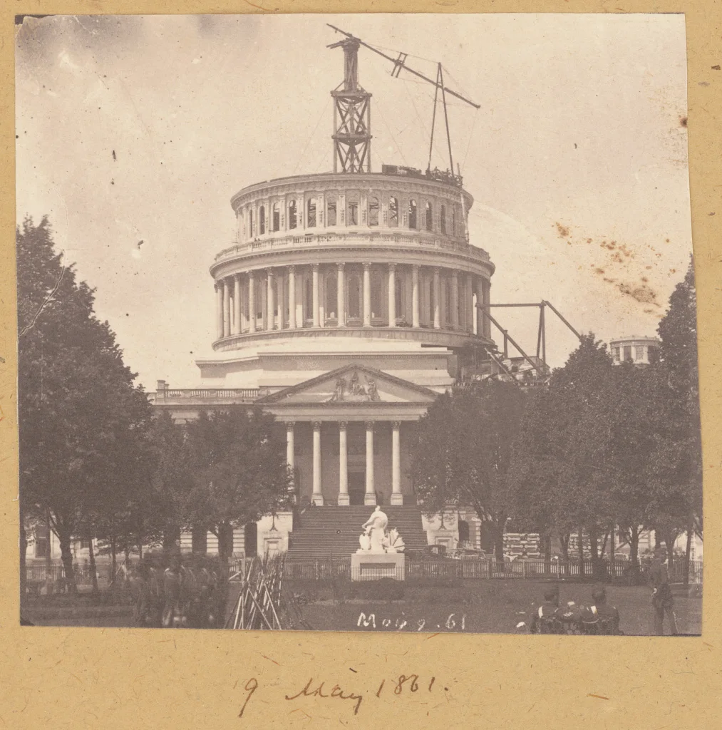 The U.S. Capitol’s new dome rises above scaffolding during the Civil War era.